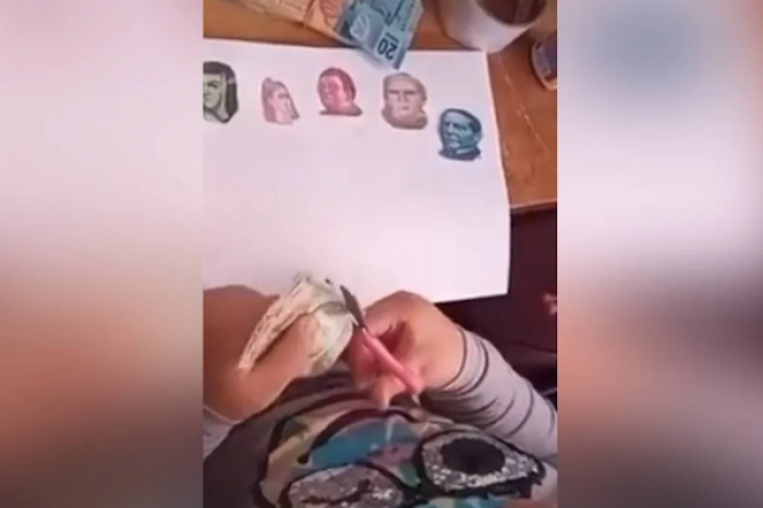 Niña se vuelve viral tras cortar caritas de billetes para hacer tarea